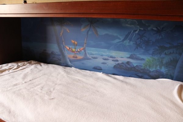 an open Murphy bed with a mural painted inside from Lilo and Stitch