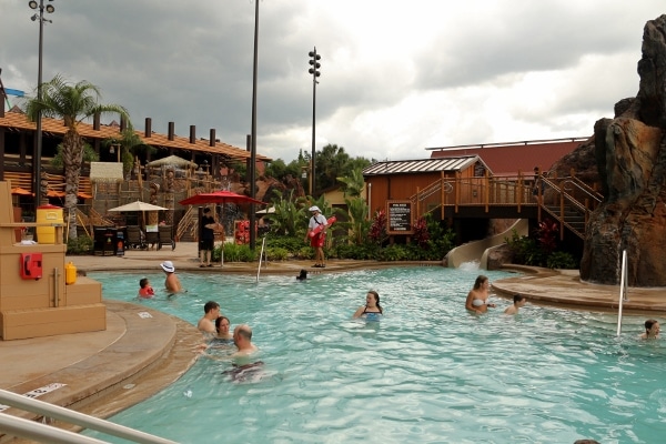 A group of people swimming in a large swimming pool