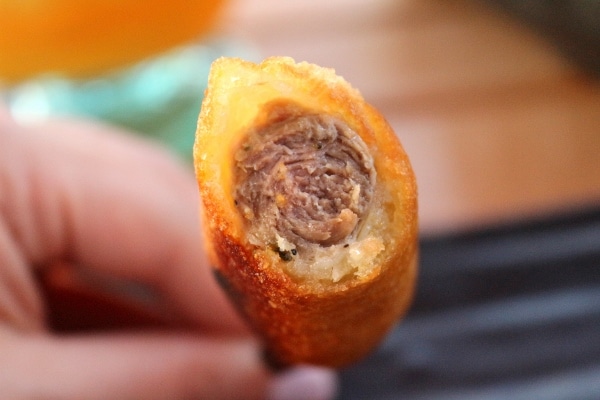 a closeup of a half-eaten corn dog