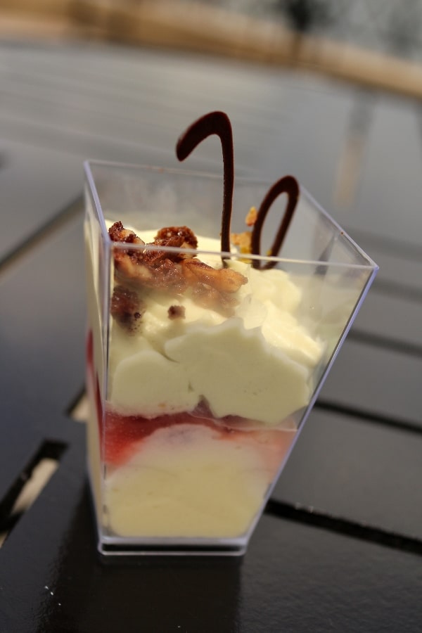 A dessert parfait in a small plastic cup