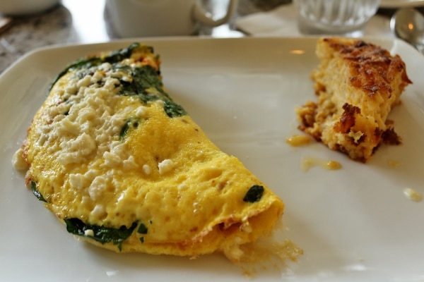 a closeup of an omelet with vegetables and cheese