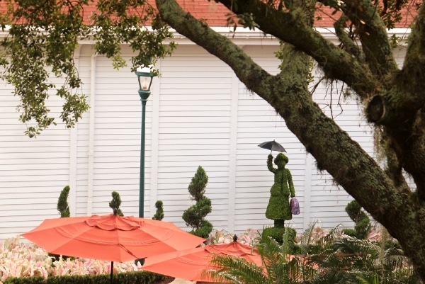 a Mary Poppins topiary outside a building