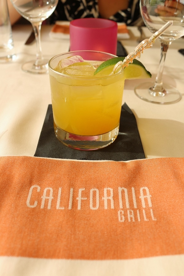 a cloth napkin that says California Grill and a cocktail in a glass