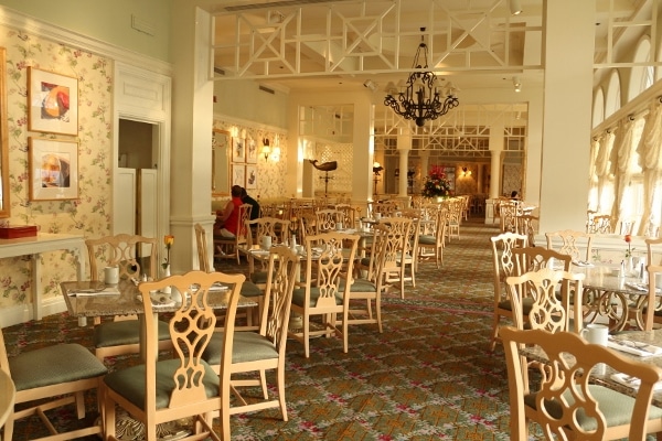 the interior of the Grand Floridian Cafe with lots of tables and chairs