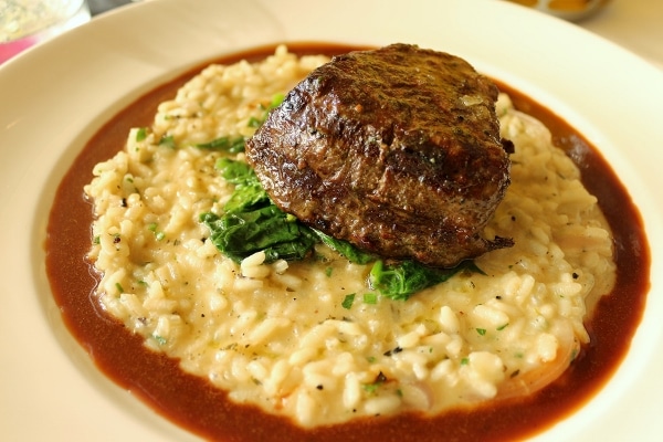 filet mignon served over a bed of risotto