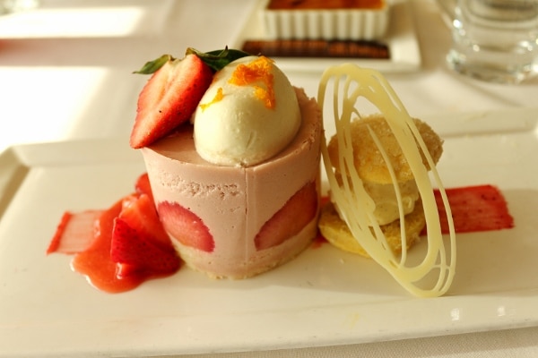 a dessert made with strawberries and topped with a scoop of ice cream