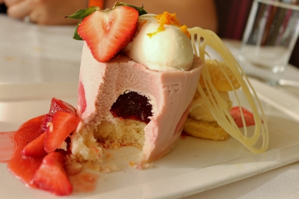a half eaten dessert made with strawberries
