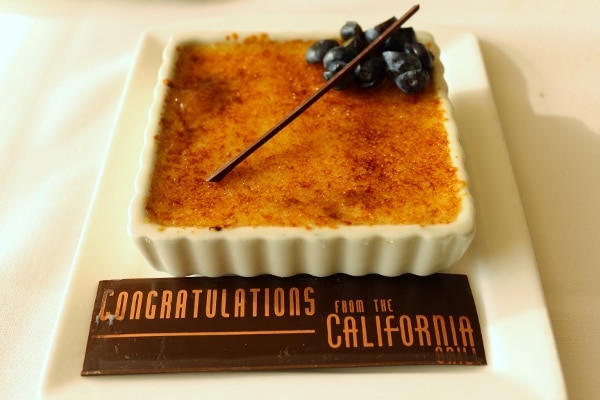 creme brulee in a square dish with a sign saying Congratulations from the California Grill