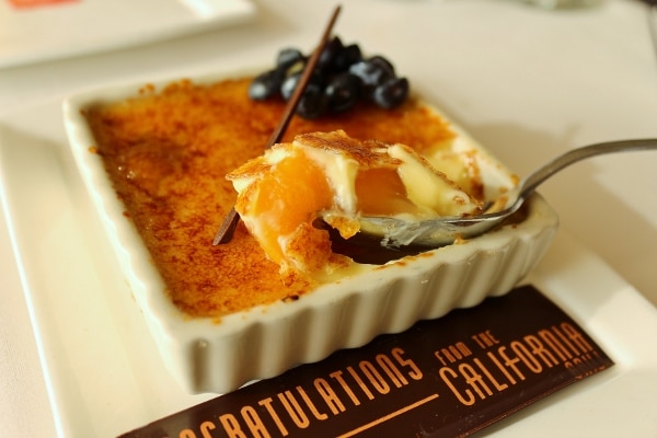 a scoop of creme brulee with peaches in it