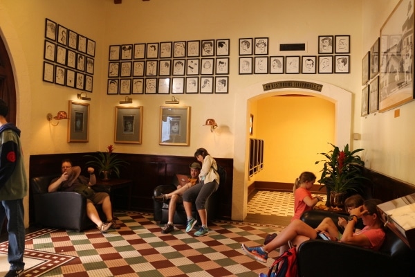 A group of people in a waiting area inside a restaurant