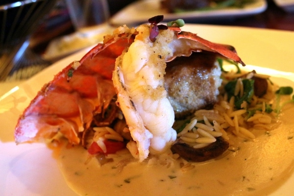 a closeup of a lobster tail on a plate