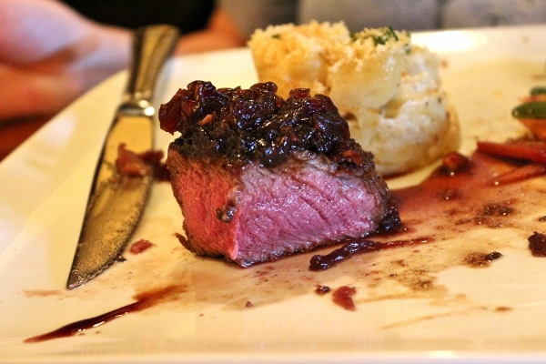 cross-section of a rare steak on a plate