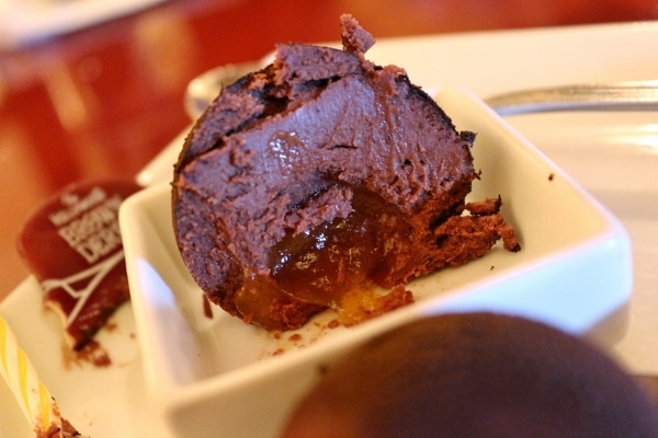 a cross-section of a chocolate truffle with filling inside
