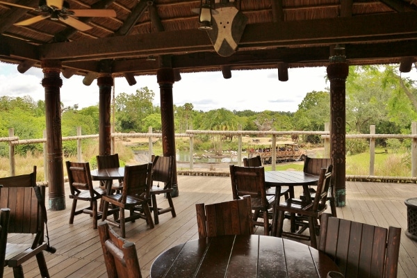 an outdoor dining area under a roof