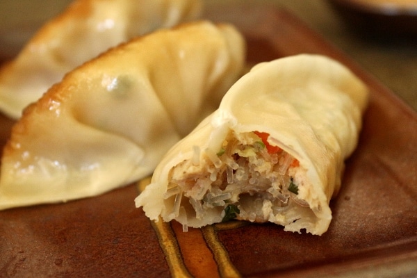 A close up of the filling in a chicken and thai basil dumpling