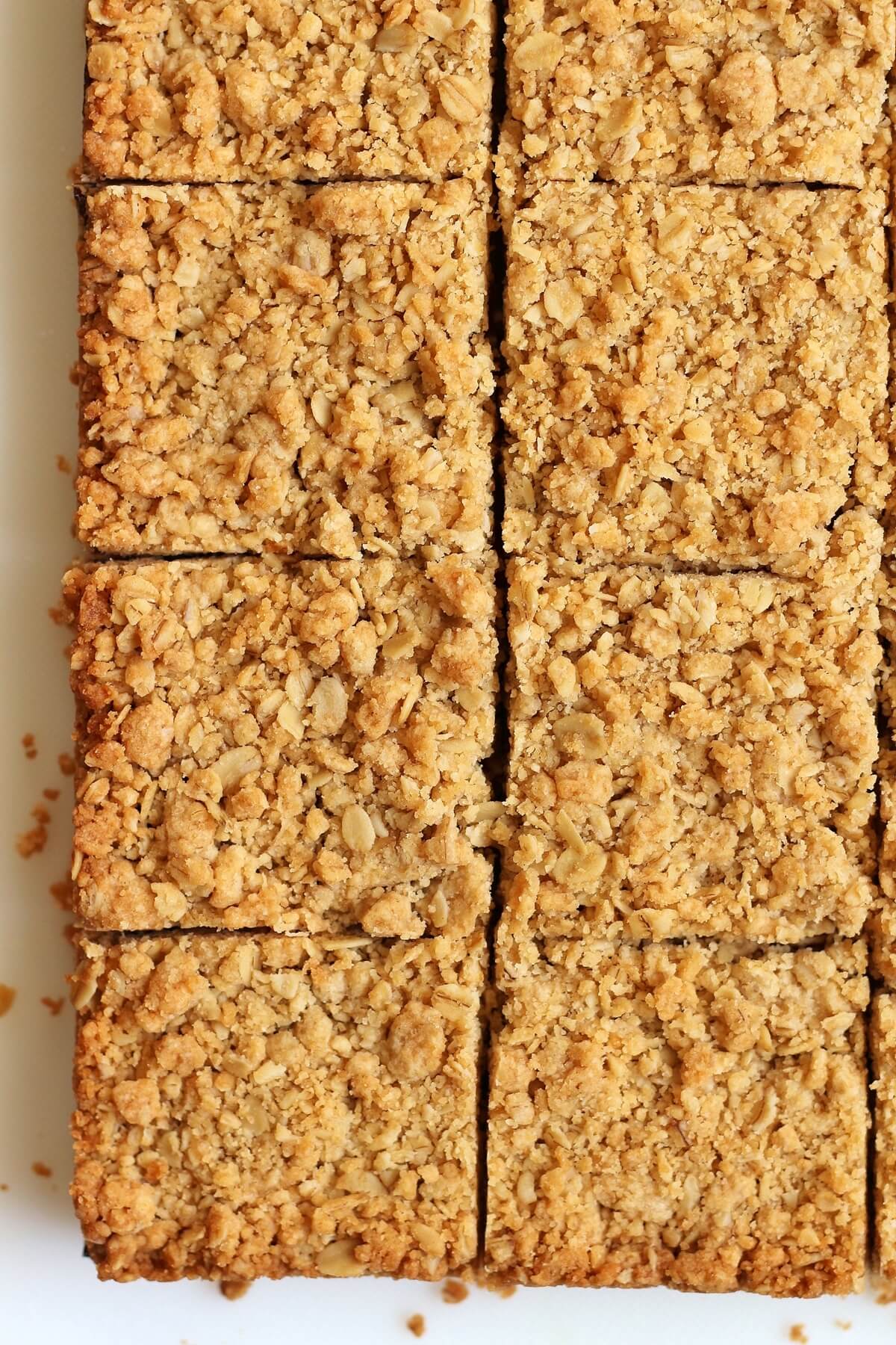 overhead closeup of guava bars cut into squares on a cutting board