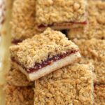 a platter of guava bars with crumbly oat topping
