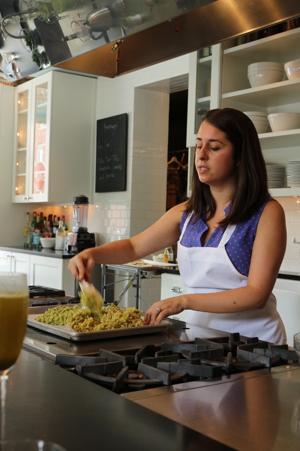 A woman preparing food in a kitchen