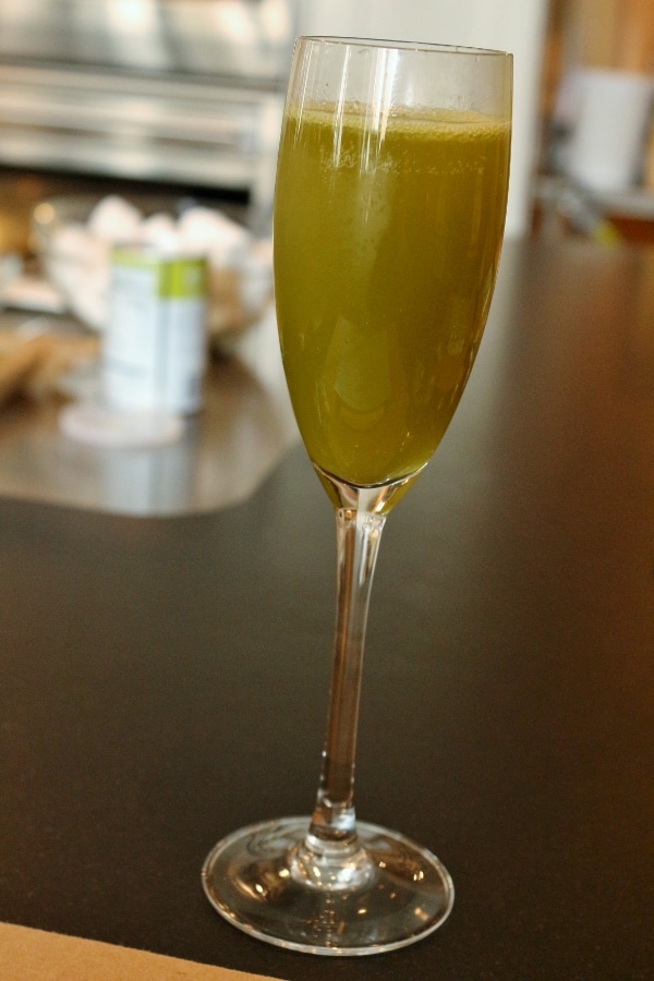 a closeup of a beverage in a champagne glass