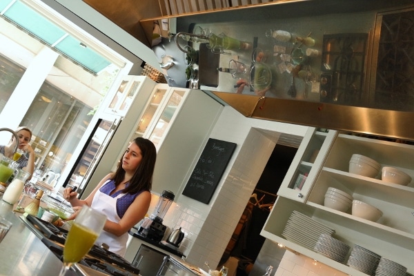 a woman standing in a kitchen