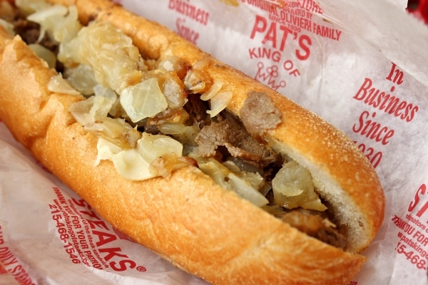 a Philly cheesesteak sandwich in a wrapper that says Pat\'s