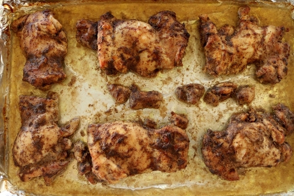 chicken thighs baked on a baking sheet