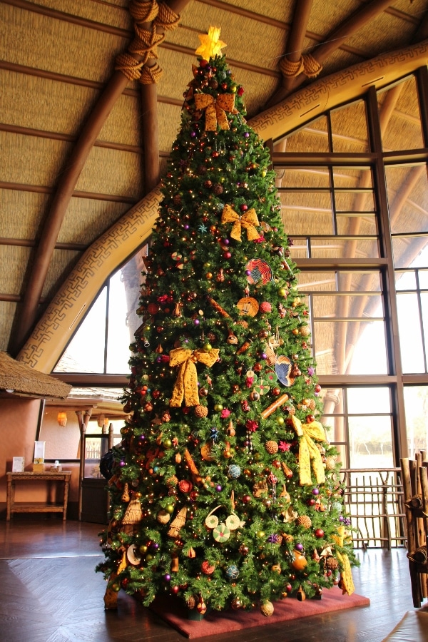 a Christmas tree inside the intimate lobby of Disney\'s Animal Kingdom Villas - Kidani Village