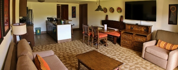 the kitchen and living room area inside a 2-bedroom villa at Disney\'s Animal Kingdom Villas