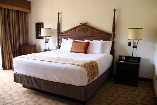 A hotel bedroom with a king size bed