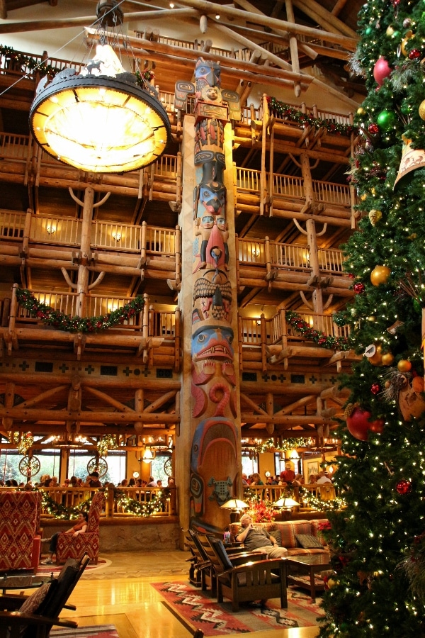 view of tall totem poles inside the Wilderness Lodge lobby