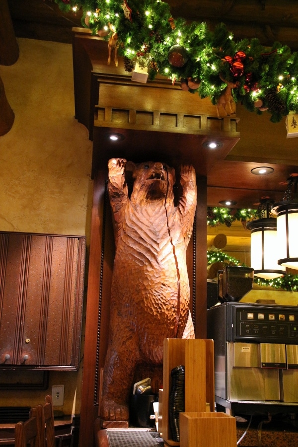 a statue of a bear inside a lounge