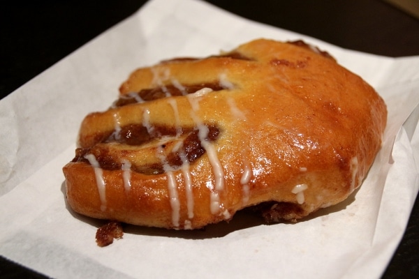 a bear claw pastry on a white plate