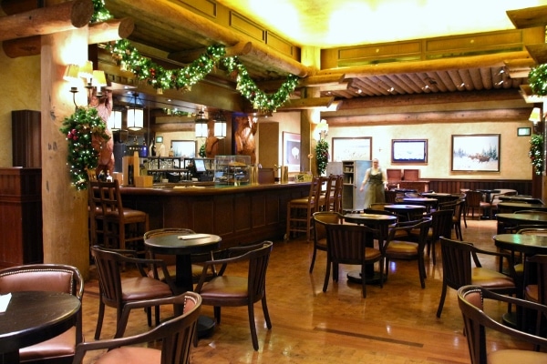 the bar and seating area inside Territory Lounge at Disney\'s Wilderness Lodge