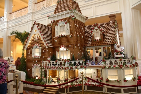 a large gingerbread house inside the Grand Floridian lobby