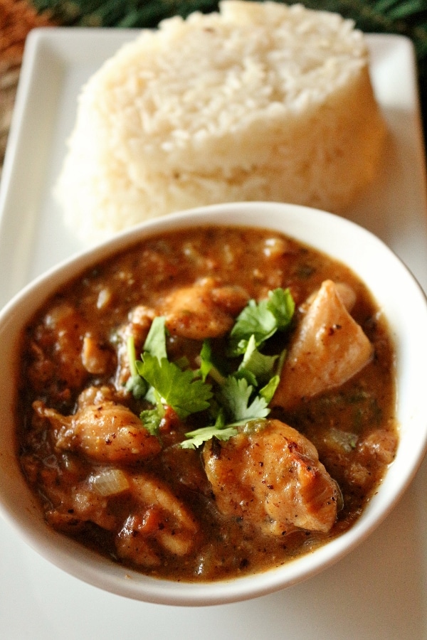 a bowl of Tusker House\'s Cape Malay chicken curry with basmati rice