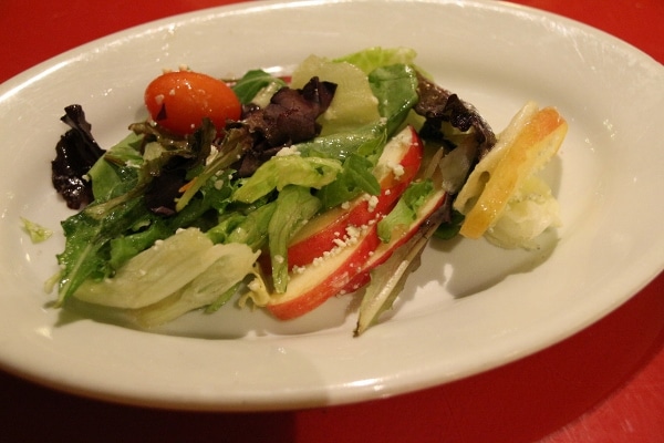 a serving of salad on an oval plate