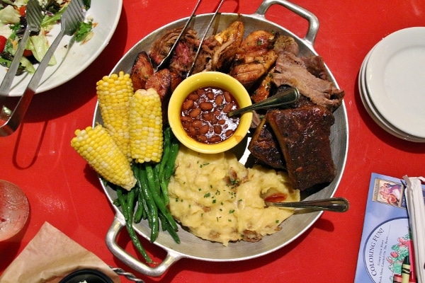 the All-You-Care-To-Enjoy Skillet with various meats, mashed potatoes, beans, and corn