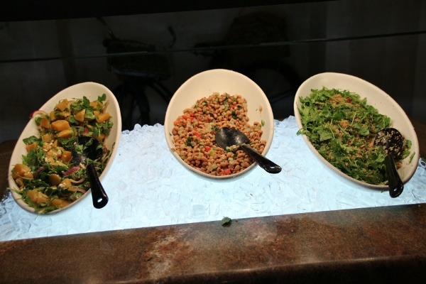 a variety of cold salads on a buffet line