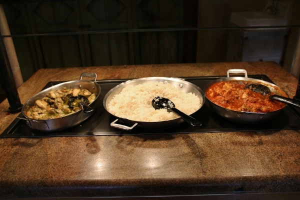 rice and 2 kinds of curry on a buffet line