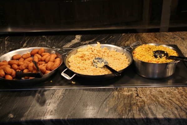 mini corn dogs, macaroni and cheese, and corn on a buffet line