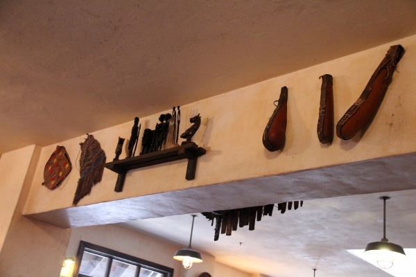 African artifacts hanging from a wall