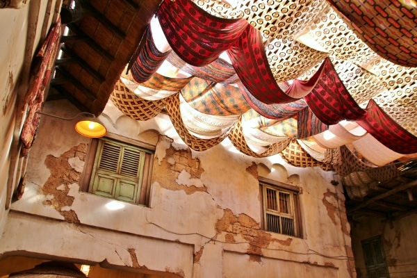 strips of colorful fabric hanging from the ceiling of Tusker House Restaurant