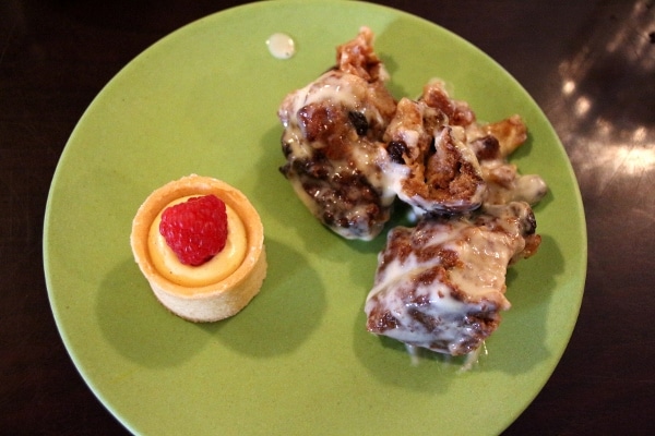 a small selection of desserts on a green plate