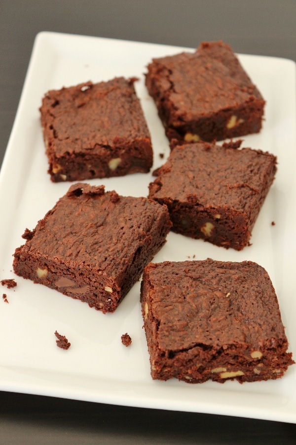 a wide view of a plate of brownies with walnuts and chocolate chips