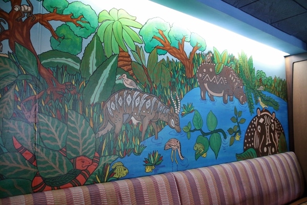 a painted mural of animals on a wall