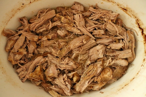 pulled chunks of fork-tender pork in a slow-cooker