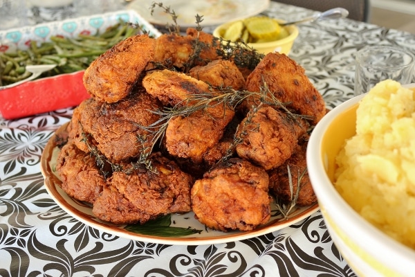 a platter of fried chicken on a black and white tablecloth