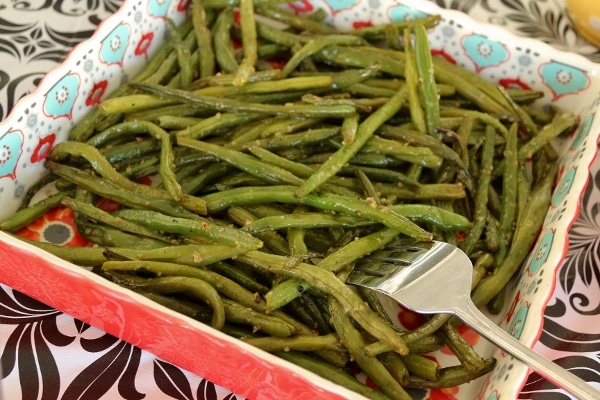 sauteed green beans in a square serving dish