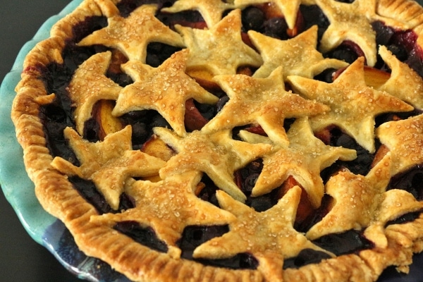 a fruit pie with star cutouts making up the top crust