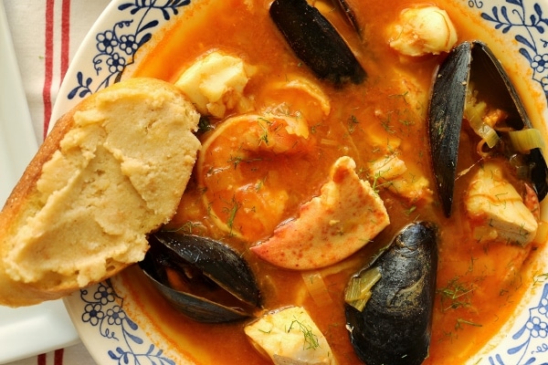 a closeup of a bowl of bouillabaisse seafood stew